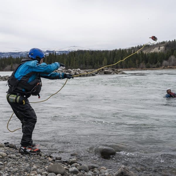 Canadian Outdoor Academy swift water rescue course using throwbag